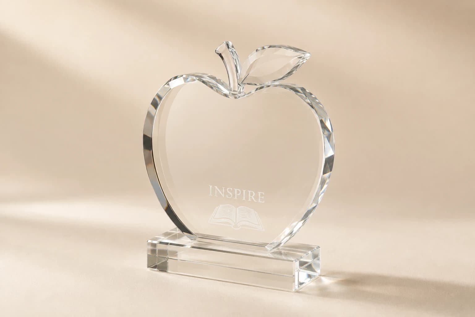 Clear faceted apple award with a polished acrylic base.