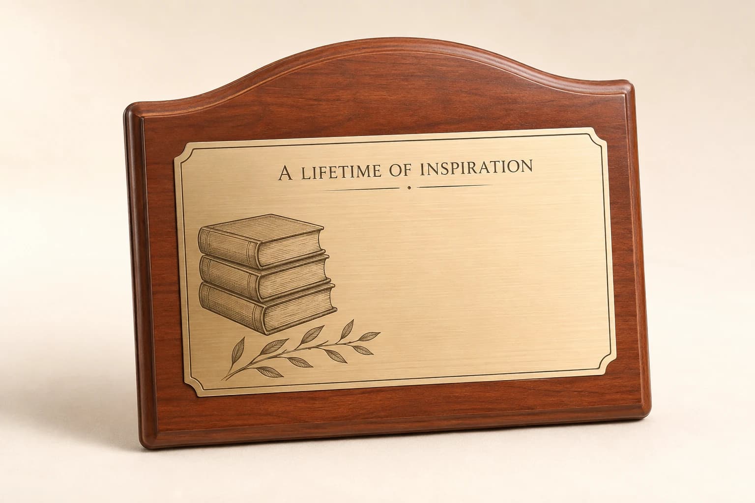 Cherry teacher retirement plaque with engraved books and a brass face.